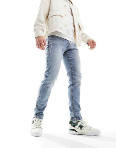 Jeans skinny lavaggio chiaro con abrasioni - ASOS DESIGN - Modalova