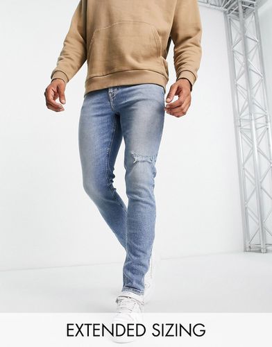 Jeans skinny lavaggio chiaro con strappi - ASOS DESIGN - Modalova