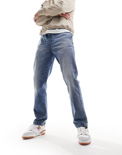 Jeans stile joggers lavaggio medio con fermacorda - ASOS DESIGN - Modalova
