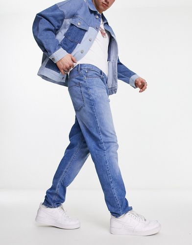 Jeans stretch affusolati lavaggio azzurro - ASOS DESIGN - Modalova