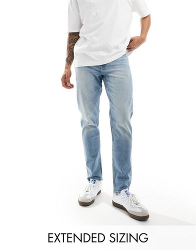Jeans stretch affusolati lavaggio azzurro - ASOS DESIGN - Modalova