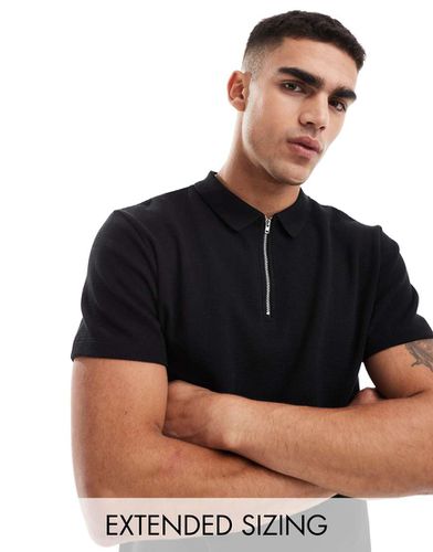 Polo nera a nido d'ape con zip sul collo - ASOS DESIGN - Modalova