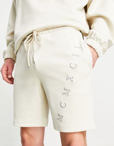 Pantaloncini oversize in tessuto scuba con ricami di numeri romani in coordinato - ASOS DESIGN - Modalova