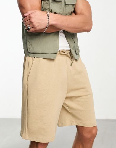 Pantaloncini oversize lunghezza media in jersey beige - ASOS DESIGN - Modalova