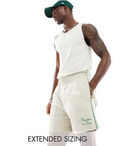 Pantaloncini ampi in nylon écru con profili verdi - ASOS DESIGN - Modalova