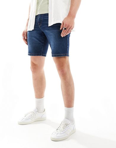 Pantaloncini di jeans skinny lunghezza standard tinto - ASOS DESIGN - Modalova