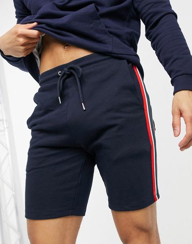 Pantaloncini skinny in jersey con riga laterale in maglia - ASOS DESIGN - Modalova