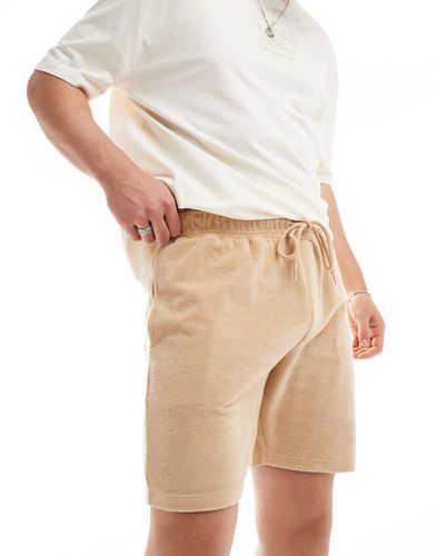 Pantaloncini slim beige in spugna - ASOS DESIGN - Modalova