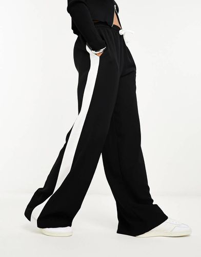 Pantaloni neri con pannello a contrasto - ASOS DESIGN - Modalova