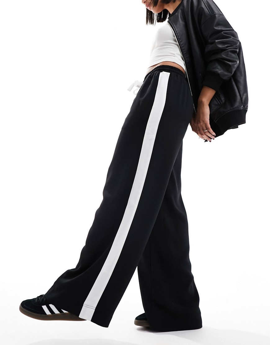 Pantaloni neri con pannello a contrasto - ASOS DESIGN - Modalova