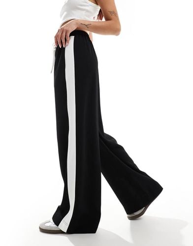 Pantaloni neri con pannello a contrasto - ASOS DESIGN - Modalova