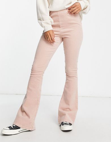 Pantaloni a fondo ampio a coste color cipria - ASOS DESIGN - Modalova