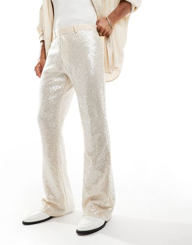 Pantaloni a zampa eleganti bianchi con paillettes - ASOS DESIGN - Modalova