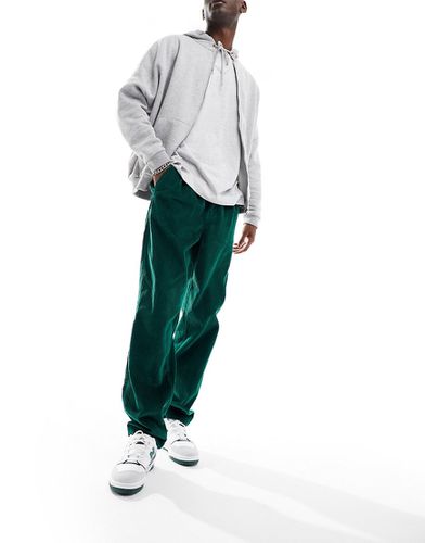 Pantaloni ampi in velluto a coste verdi - ASOS DESIGN - Modalova