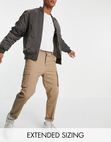 Pantaloni cargo comodi color pietra - ASOS DESIGN - Modalova