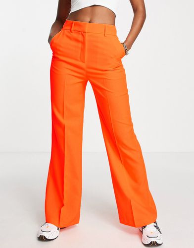 Pantaloni comodi a fondo ampio a zampa arancioni - ASOS DESIGN - Modalova