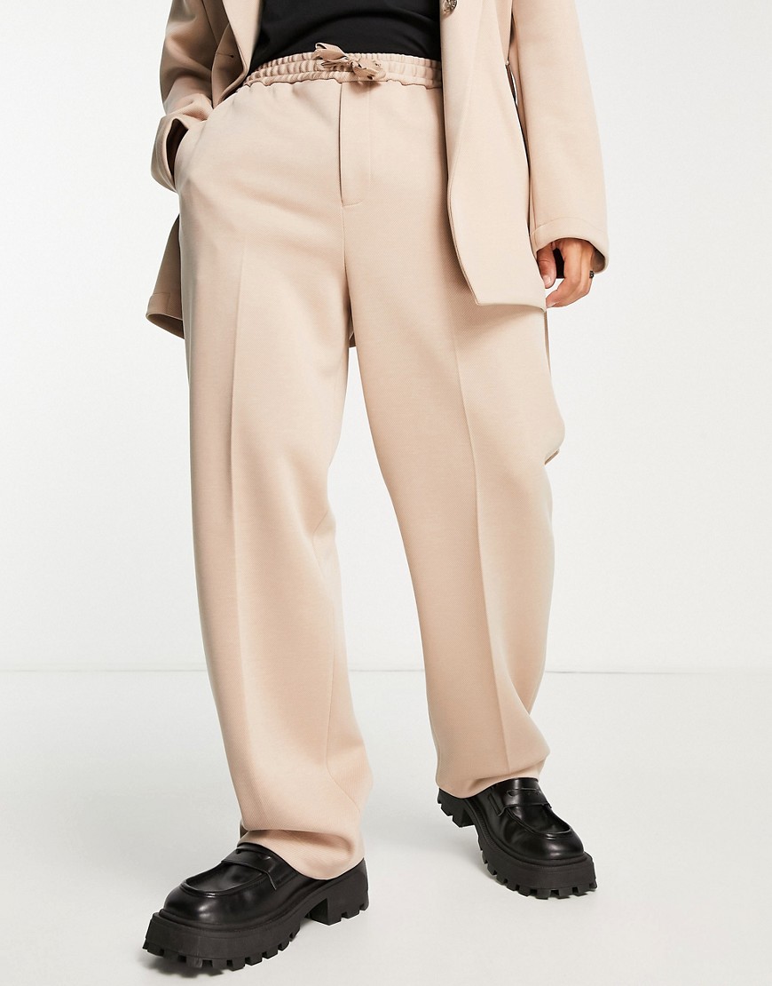 Pantaloni da abito a fondo ampio in twill color pietra - ASOS DESIGN - Modalova