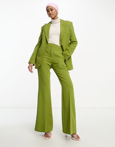 Pantaloni da abito a zampa color muschio - ASOS DESIGN - Modalova