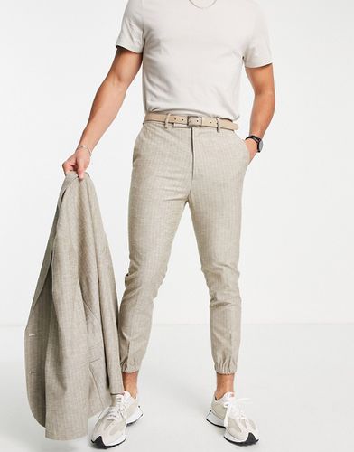 Pantaloni da abito affusolati a righe con fondo elasticizzato color pietra - ASOS DESIGN - Modalova