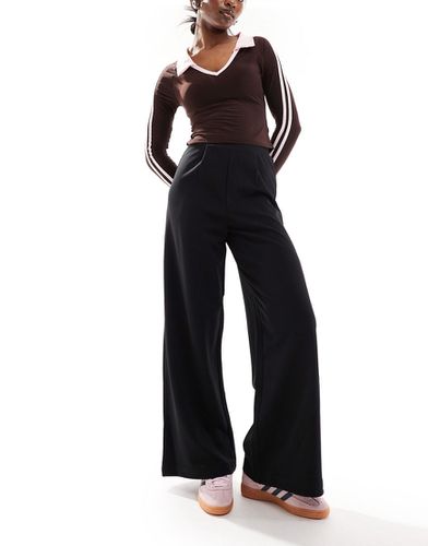 Pantaloni da abito con fondo ampio neri in jersey - ASOS DESIGN - Modalova