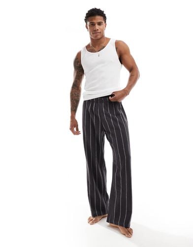 Pantaloni del pigiama neri a righe - ASOS DESIGN - Modalova