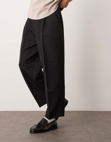 Pantaloni eleganti a palloncino neri con pieghe sul davanti - ASOS DESIGN - Modalova