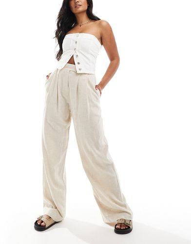 Pantaloni sartoriali a fondo ampio colore in lino con pieghe - ASOS DESIGN - Modalova