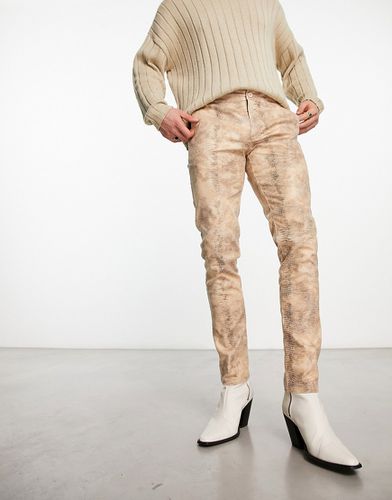 Pantaloni skinny a vita bassa con stampa pitonata - ASOS DESIGN - Modalova