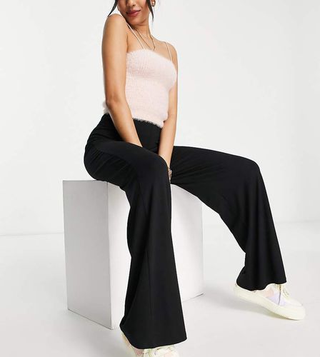 ASOS DESIGN Petite - Pantaloni basic in jersey con fondo ampio neri - ASOS Petite - Modalova