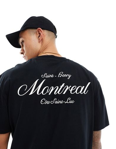 T-shirt comoda nera con stampa "Montreal" sul retro - ASOS DESIGN - Modalova
