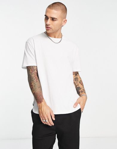 T-shirt lunga comoda bianca con fondo arrotondato - ASOS DESIGN - Modalova