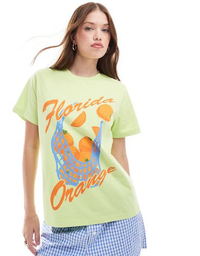 T-shirt oversize verde con grafica "Florida Orange" - ASOS DESIGN - Modalova