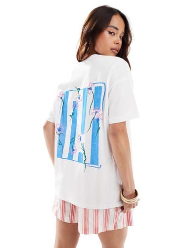 T-shirt oversize avorio con grafica di fiore - ASOS DESIGN - Modalova