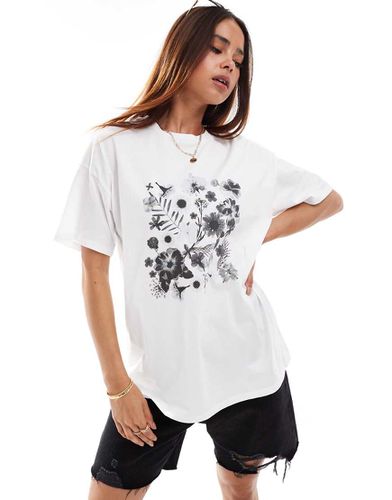 T-shirt oversize bianca con grafica di fiori - ASOS DESIGN - Modalova