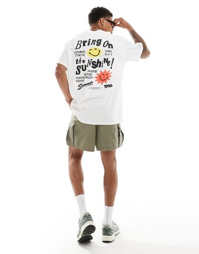 T-shirt oversize bianca con stampa "Smile Sunshine" sul retro - ASOS DESIGN - Modalova