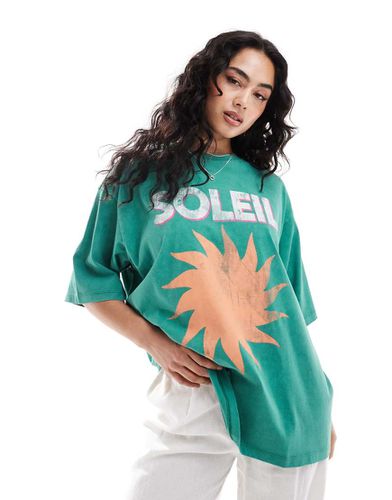 T-shirt oversize con scritta "Soleil" slavato - ASOS DESIGN - Modalova