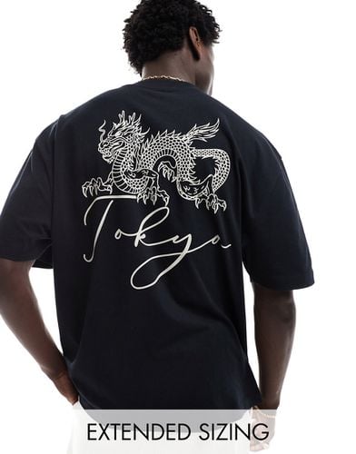 T-shirt oversize nera con grafica "Tokyo" con drago sul retro - ASOS DESIGN - Modalova