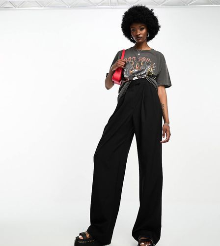 ASOS DESIGN Tall - Pantaloni sartoriali a fondo ampio neri a pieghe - ASOS Tall - Modalova