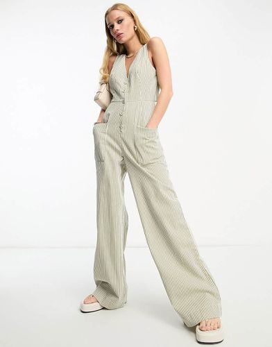 Tuta jumpsuit a righe con bottoni - ASOS DESIGN - Modalova