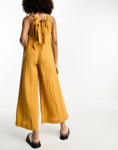 Tuta jumpsuit minimal stropicciata color senape - ASOS DESIGN - Modalova