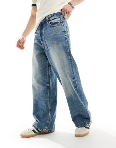 Jeans super larghi medio slavato - Bershka - Modalova