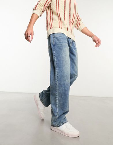 Jeans comodi lavaggio medio - GUESS Originals - Modalova