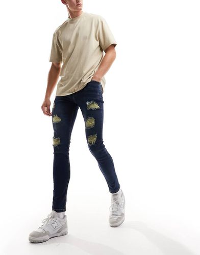 DTT - Jeans skinny stretch invecchiati blu scuro con strappi evidenti - Don't Think Twice - Modalova