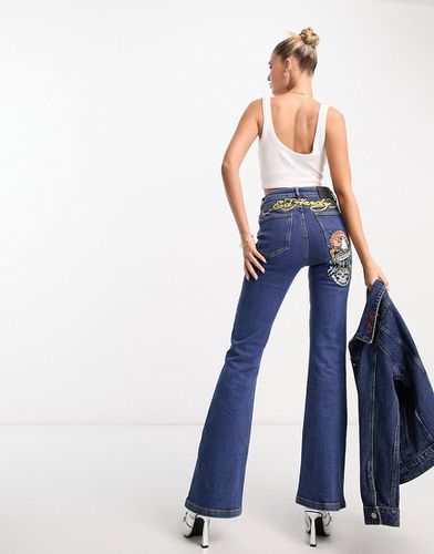 Jeans aderenti a zampa con logo sul retro - Ed Hardy - Modalova