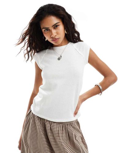 T-shirt corta e stretta bianca con maniche raglan - Free People - Modalova