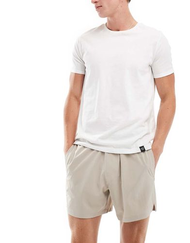 Pantaloncini ibridi da 5" in nylon beige con logo tono su tono - Hollister - Modalova