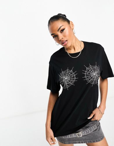 T-shirt nera con motivo con ragno - In The Style - Modalova