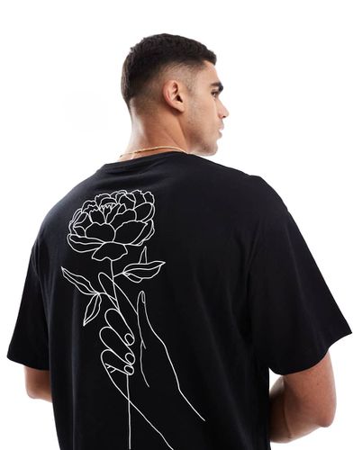 T-shirt nera oversize con stampa di fiore sulla schiena - Jack & Jones - Modalova