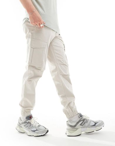 Pantaloni cargo beige con fondo elasticizzato vestibilità comoda - Jack & Jones - Modalova