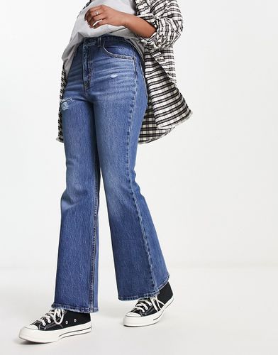 Jeans a vita alta a zampa invecchiati lavaggio medio stile anni '70 - Levi's - Modalova